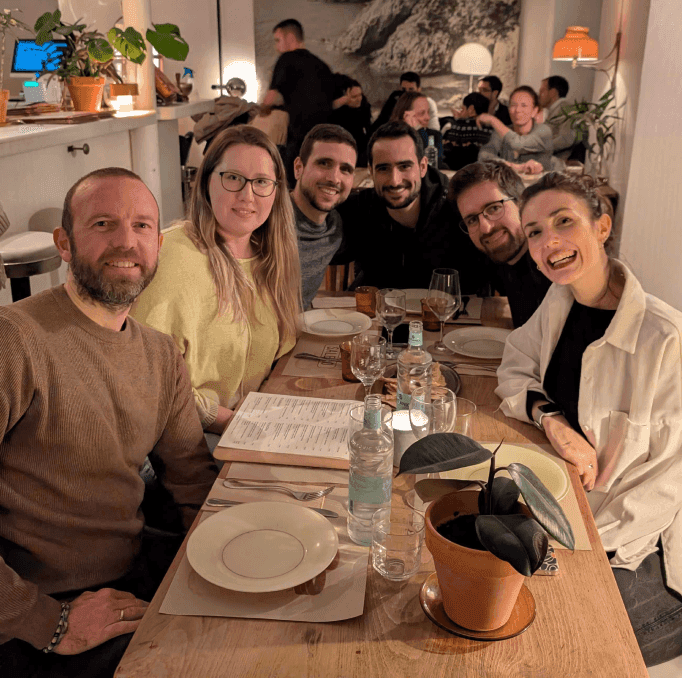 Tiger Data teammates gathered around a table